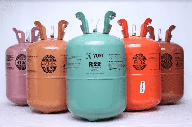 Commercial refrigerant gas cylinders stored in a supply warehouse